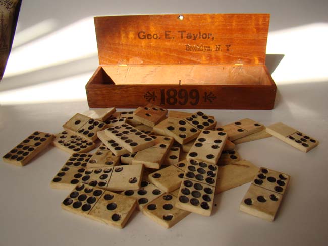 A set of 36 antique 19th century solid bone dominoes in a box inscribed "Geo. E. Taylor, Brooklyn, N.Y. 1899."